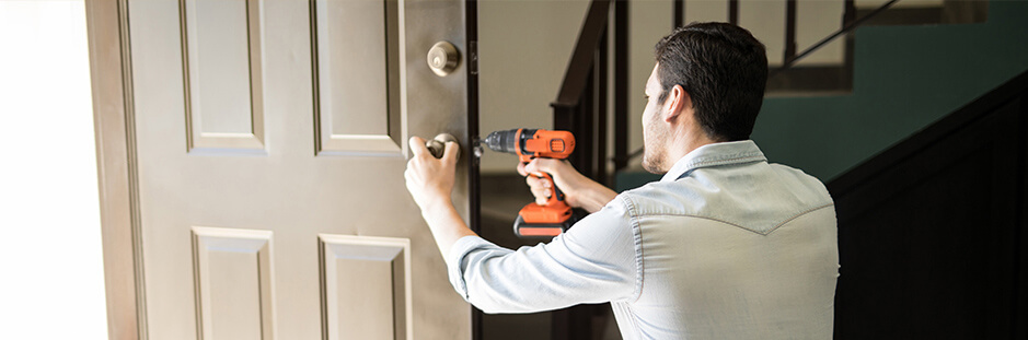 Handyman working on door